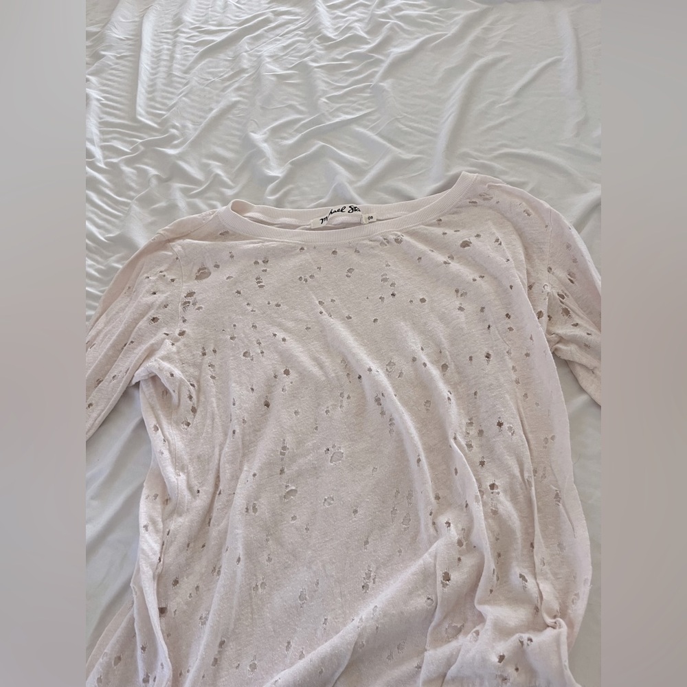 Long sleeve shirt. Good condition. Pale pink w decretive holes .